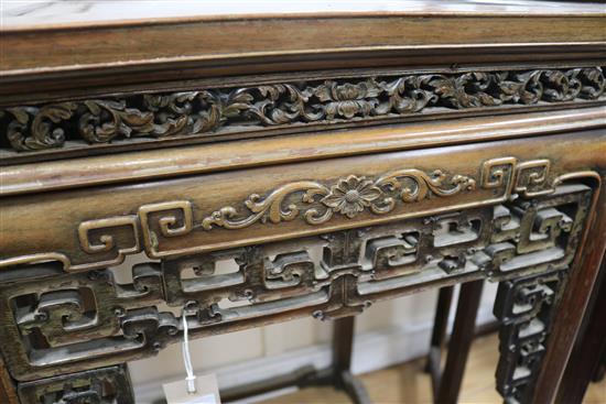 A Chinese huali wood urn stand, having panelled top and pierced frieze W.52cm